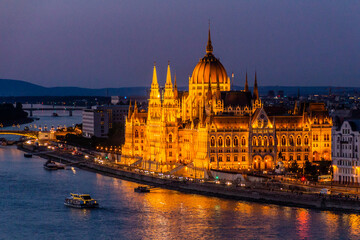 Fototapeta na wymiar Evening view of Danube river and Hungarian Parliament Building in Budapest, Hungary