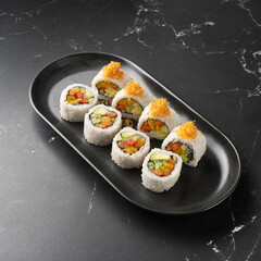 Vegan Futomaki with zucchini, celery stalks, carrot, red cabbage, red bell pepper