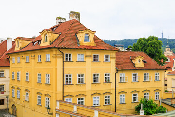 Fototapeta premium Facade of the house of classical European architecture of the old cozy tourist city. Background