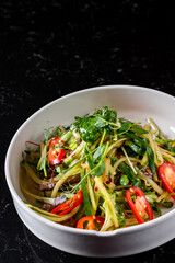meat salad with vegetables on plate
