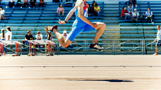 male athlete tripl jump athletics competition, Adidas jump spikes and Nike clothet team Russia, sports editorial photo