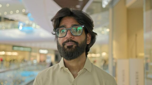 Arabian businessman Indian man worker company CEO corporate manager business executive male entrepreneur walking indoors in office corporation client guy buyer walk in shopping mall talking greeting