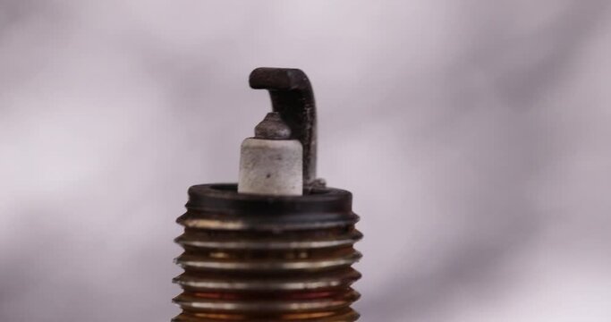 consider old very damaged car spark plugs, close-up of old used car spark plugs that don't work well