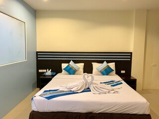 Hotel Room Decorated single bedroom with bed nice colours