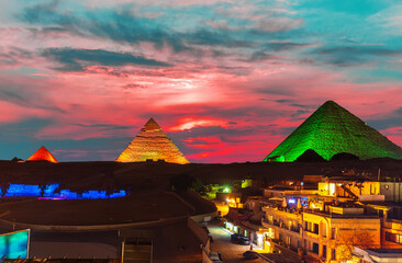 The Great Pyramid complex enlighted at night, Giza, Egypt