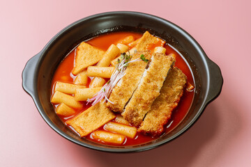 Tteokbokki, Stir-fried Rice Cake : Sliced rice cake bar (garaetteok) or thin rice cake sticks (Tteokbokkitteok) stir-fried in a spicy gochujang sauce with vegetables and fish cakes.