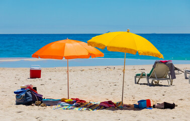 Fototapeta na wymiar Lounger chairs and parasol umbrellas on sandy beach in Cape Town
