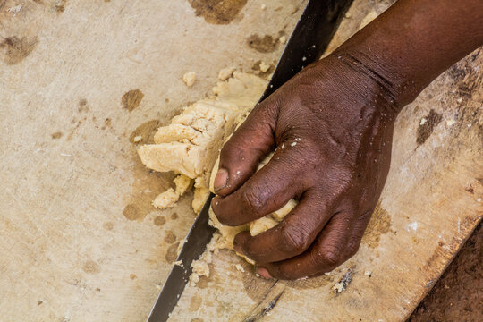 Dorze woman is preparing dough for kocho bread made of enset (false banana), important source of food, Ethiopia