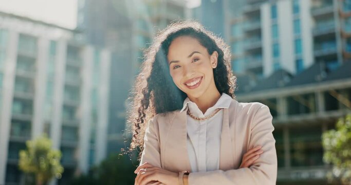 Business, happy woman in city and face with arms crossed, career success and corporate lawyer outdoor with smile. Professional mindset, confidence and pride with portrait, urban and female attorney