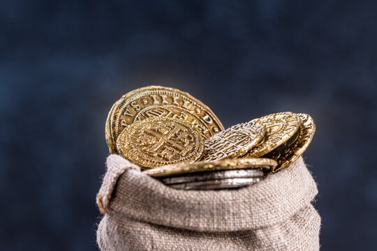 Medieval coins in an rag bag close-up