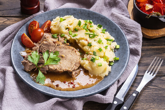 Baked pork with mashed potatoes and scallion