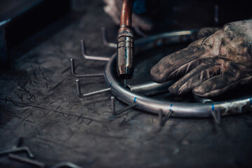Close up of the steel welding process. Work in the heavy steel industry