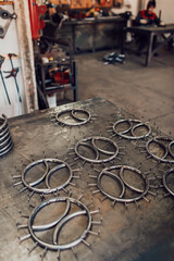 Pieces of steel lined up on the table ready for the welding process