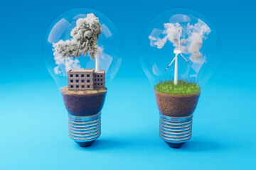 lightbulbs with minature wind turbine and coal-fired power station  inside; green soil and clouds; pollution and smoke; renewable clean energy concept; infinite background; 3D Illustration