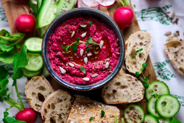Beetroot dip with fresh vegetables. top view .