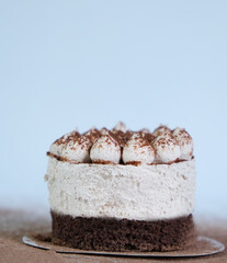 Portioned tiramisu cake. Airy creamy curd biscuit sweetness.
Dessert without sugar, low-calorie. Craft pastry shop, baking recipe