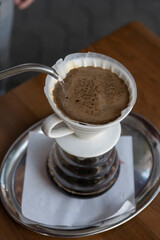 the process of preparing coffee with a filter .close-up of a cup of coffee