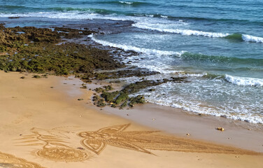 Beautiful beach mandala in Albufeira in Portugal Praia Maria Luisa