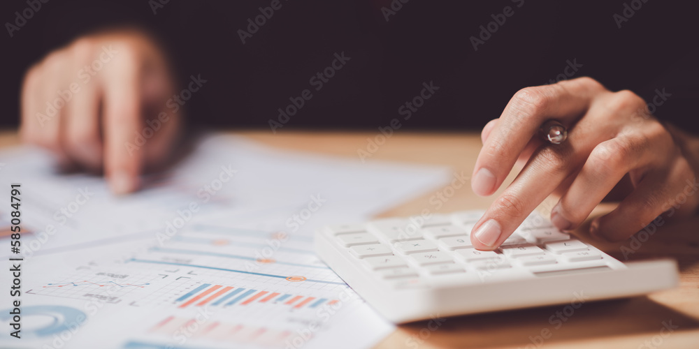 Poster Businessman calculating figures in company financial documents with a calculator,reading graph report and business statistics charts ,Analysis and improvement of corporate strategy,Statistics and Data