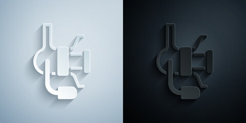 Paper cut Spinning reel for fishing icon isolated on grey and black background. Fishing coil. Fishing tackle. Paper art style. Vector