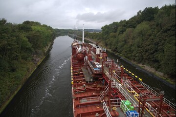 Tanker vessel sailing narrow river