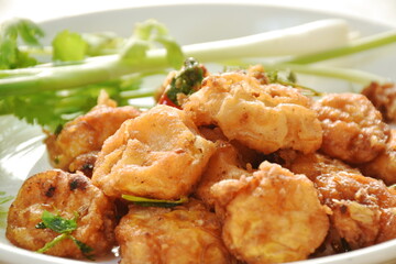 crispy tofu stuffed flour dressing garlic and pepper with spring onion couple parsley on plate - obrazy, fototapety, plakaty