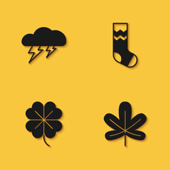 Set Cloud and lightning, Chestnut leaf, Four clover and Socks icon with long shadow. Vector