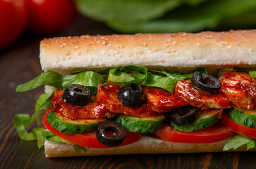 sandwich with olives and tomato, close up