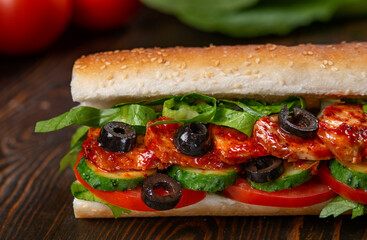 sandwich with olives and tomato, close up