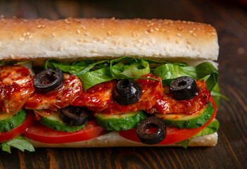 sandwich with olives and tomato, close up