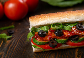 sandwich with olives and tomato, close up
