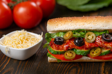 sandwich with olives and tomato, close up