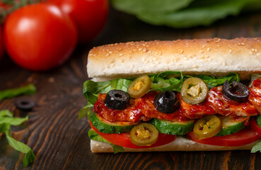 sandwich with olives and tomato, close up