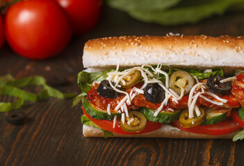 sandwich with olives and tomato, close up