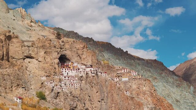 4K shot of Phugtal Monastery made in a natural cave near Purne village in Zanskar, Ladakh India. Ancient monastery made in a cave more than 2550 years ago in India. Monastery built inside the cave.	