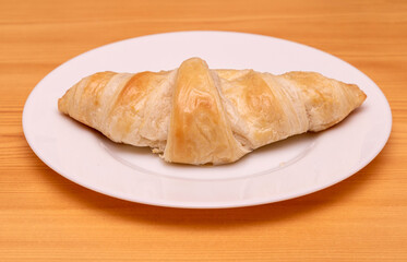 Butter croissant on plate