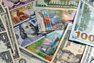 Background of American USA dollars cash money banknotes of different values and Kuwait dinars bills, Kuwaiti money and American currency exchange rate concept, money banknote market concepts - obrazy, fototapety, plakaty