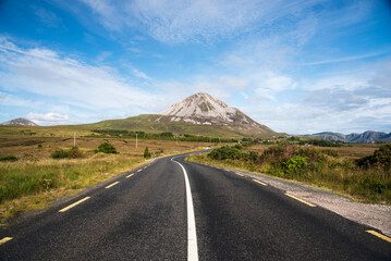 Scenic road in Ireland with mount Errigal in background