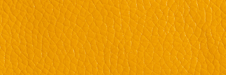 Yellow leather and a textured background, wide banner.