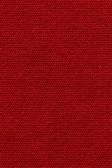 Red color sports clothing fabric football shirt jersey texture and textile background.