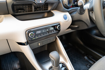 Interior of a Japenese-built, new technology hybrid small car. Showing part of the auto...