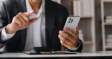 Women holding credit card and using smartphones at home.Online shopping, internet banking, store online, payment, spending money, e-commerce payment at the store, credit card, concept
