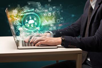 Business hand typing on a modern laptop