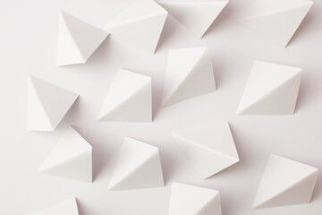 White abstract triangle shapes on white background