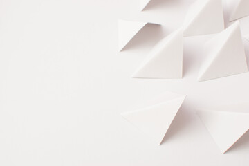 White background with 3d triangle shapes, close up
