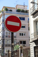 A Circle Red Street Sign with White Stripe as a Sign of No Entry