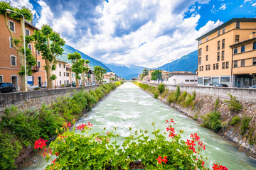Town of Tirano and Adda river waterfront view - obrazy, fototapety, plakaty