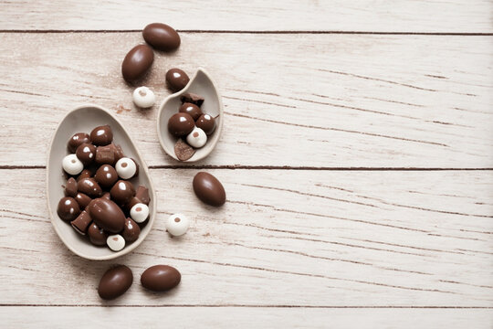Nice background with chocolate egg and chocolate candies inside