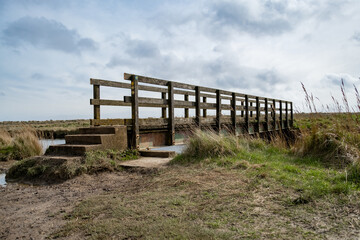 Fototapeta premium Bridge over the river on the Suffolk Coast Path