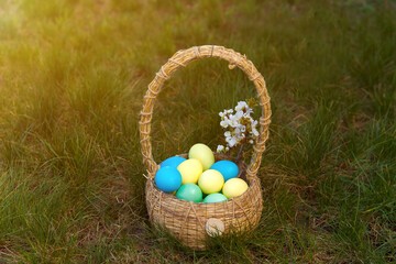 Paint eggs for Easter, bright Easter holiday, children paint eggs, colored eggs in a basket, colored eggs on a stand, Holiday background 